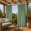 A covered patio with outdoor furniture and curtains. Podgląd zdjęcia produktu