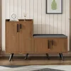 A shoe cabinet with a built-in bench is shown in a room with a wood-paneled wall. Náhľad obrázku produktu