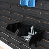 A close-up view of black storage bins filled with bolts and screws, mounted on a black pegboard system. Anteprima dell’immagine prodotto