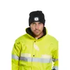 A man wearing a black beanie with an LED light and a yellow high-visibility jacket. Produktbild-Vorschau