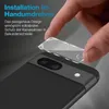 A hand is shown applying a camera lens protector to a smartphone. Produktbild-Vorschau