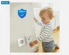 A baby is interacting with a wall socket with childproof covers. Produktbild-Vorschau