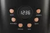 Close-up of a black coffee maker's control panel with a digital clock and buttons. Náhled obrázku produktu