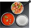A top-down view of cookware items including a pot of spaghetti and a bowl of tomato soup, with a lid nearby. Anteprima dell’immagine prodotto