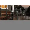 A deck at dusk with solar lights illuminating the railing and stairs. Voir les images du produit