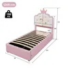 A pink bed with a crown-shaped headboard, showing dimensions and weight capacity. Produktbild-Vorschau