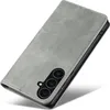 A gray flip-style phone case with a camera cutout is shown against a white background. Produktbild-Vorschau