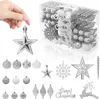 A hand holding a silver star ornament with a box of Christmas ornaments in the background. Voir les images du produit