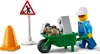 A LEGO construction scene with a traffic cone, a construction sign, a wheelbarrow with bricks and a rat, and a LEGO minifigure. Produktbild-Vorschau