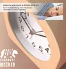 A close-up of a wooden alarm clock with a woman sleeping in the background. Produktbild-Vorschau