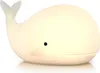 A white whale-shaped LED night light on a white background. Produktbild-Vorschau