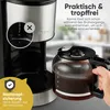 Close-up of a coffee maker with a carafe being held. Anteprima dell’immagine prodotto