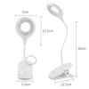 Two views of a white clip-on desk lamp with dimensions indicated by measurement lines and text. Produktbild-Vorschau