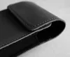 A close-up, black and white image of a black leather sleeve for a phone. Anteprima dell’immagine prodotto