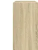 A close-up view of a wooden cabinet with a light oak finish. Produktbild-Vorschau