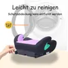 A child car seat booster is shown in front of a washing machine, with text indicating it is easy to clean and the cover is removable and machine washable. Produktbild-Vorschau