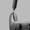 A close-up shot of an electric screwdriver tip being used on a game controller. Náhled obrázku produktu