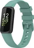 A Fitbit Inspire 3 fitness tracker with a green silicone band is shown against a white background.