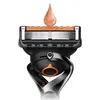 Close-up of a Gillette ProGlide razor head with a drop of shaving gel on top. Produktbild-Vorschau