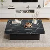 A modern living room scene featuring a square coffee table with a marble-like top and a black base, placed on a textured rug in front of a white media console. Produktbild-Vorschau