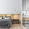A modern bedroom with a bed, wooden headboard, and a glass-enclosed bathroom. Anteprima dell’immagine prodotto