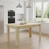A modern kitchen with a wooden dining table in the foreground. Voir les images du produit