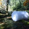 A large roll of bubble wrap is placed on the forest floor, surrounded by trees and moss. Produktbild-Vorschau