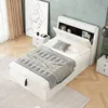 A bedroom with a white bed and nightstands. Anteprima dell’immagine prodotto