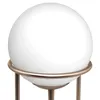 A close-up of a white spherical lamp on a bronze stand. Produktbild-Vorschau