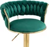 A close-up view of a green velvet bar stool with gold accents. Voir les images du produit