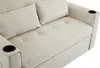 A close-up view of a beige sofa with two pillows and built-in cup holders. Produktbild-Vorschau