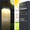 A split image showing a solar wall light in two different scenarios: one lit up at night and the other being charged by the sun during the day. Produktbild-Vorschau