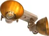A close-up studio shot of a two-headed industrial-style spotlight with brass-colored shades and a wooden base. Produktbild-Vorschau