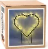 A heart-shaped outdoor Christmas light decoration on a cardboard box. Produktbild-Vorschau