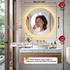 A bathroom vanity with a round LED mirror, showcasing a woman's reflection and providing installation guidance. Anteprima dell’immagine prodotto