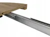 A close-up view of a table extension mechanism, showing the wooden tabletop and the metal sliding rails. Náhled obrázku produktu