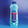 A bottle of Astonish cleaning cream with bleach against a blue gradient background. Produktbild-Vorschau