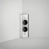 A corner of a room with a wall-mounted electrical outlet. Voir les images du produit