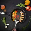 A frying pan with cooked chicken and vegetables, surrounded by fresh ingredients on a dark surface. Anteprima dell’immagine prodotto