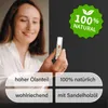A woman is holding a small perfume rollerball bottle, with marketing text and graphics overlaid on the image. Produktbild-Vorschau