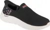 A black Skechers slip-on sneaker with a white sole and a floral pattern on the heel.