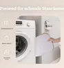 A laundry room scene showing a washing machine and a person holding a storage basket. Produktbild-Vorschau
