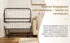 A foldable bed with a mattress is shown in a room setting. Voir les images du produit