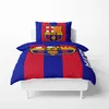 A Barcelona FC duvet cover and pillowcase set on a white bed frame. Voir les images du produit