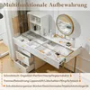A white vanity table with a gold-framed mirror and various compartments for organizing makeup and accessories. Text overlays describe the organizational features. Voir les images du produit