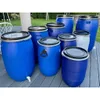 Several blue plastic barrels are arranged on a wooden deck outdoors, with a grassy area and trees in the background. Produktbild-Vorschau