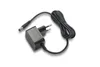 A black power adapter with a coiled cable and a European plug. Produktbild-Vorschau