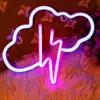 A neon sign shaped like a cloud with a lightning bolt inside, displayed on a fluffy rug with decorative elements in the background. Náhled obrázku produktu
