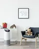 A child's room with an air purifier, a chair with teddy bears, and artwork on the wall. Anteprima dell’immagine prodotto