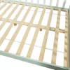 Close-up view of a wooden bed frame with a mint green border. Produktbild-Vorschau